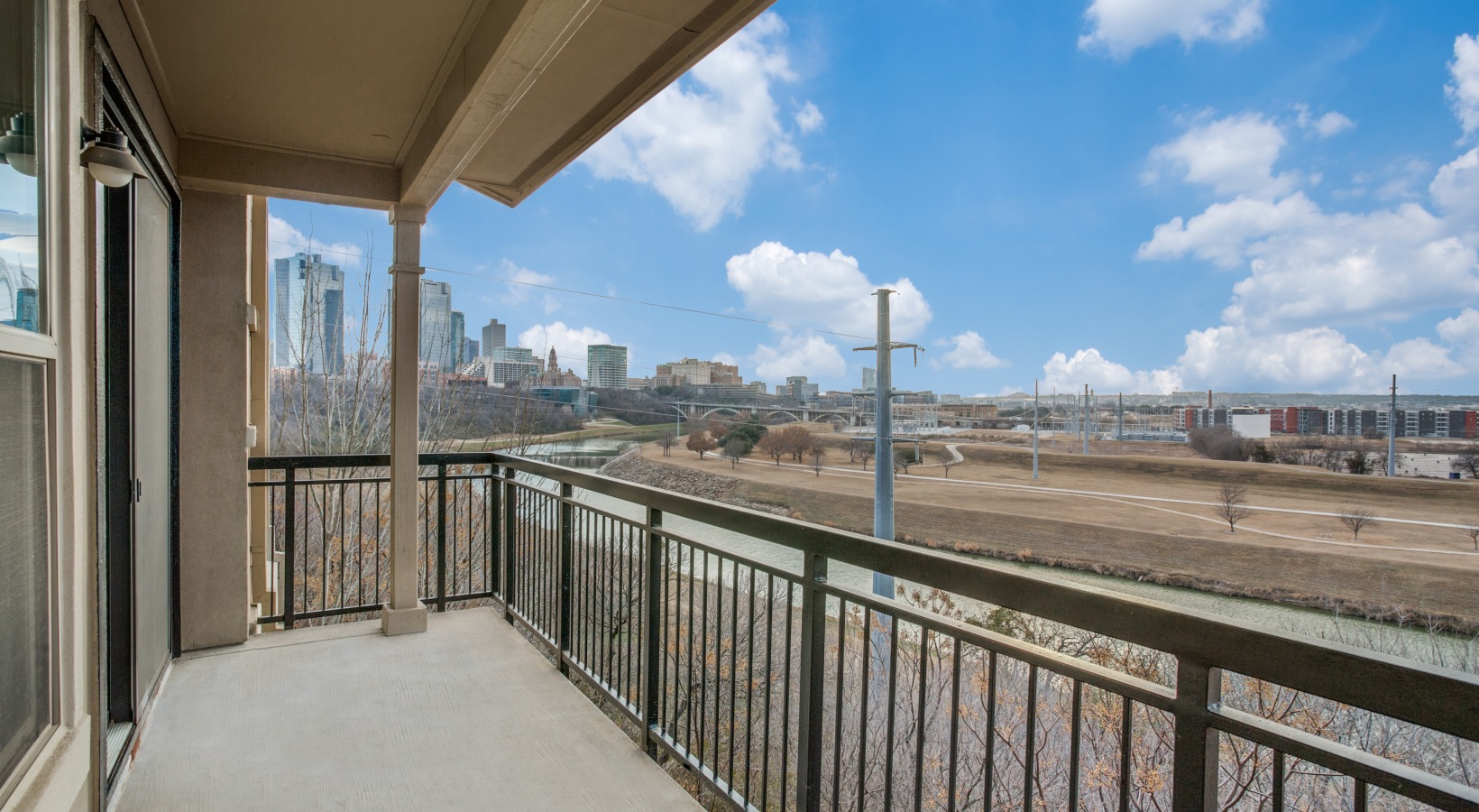 a balcony with a view of the city at The  Franklin at Samuels Ave