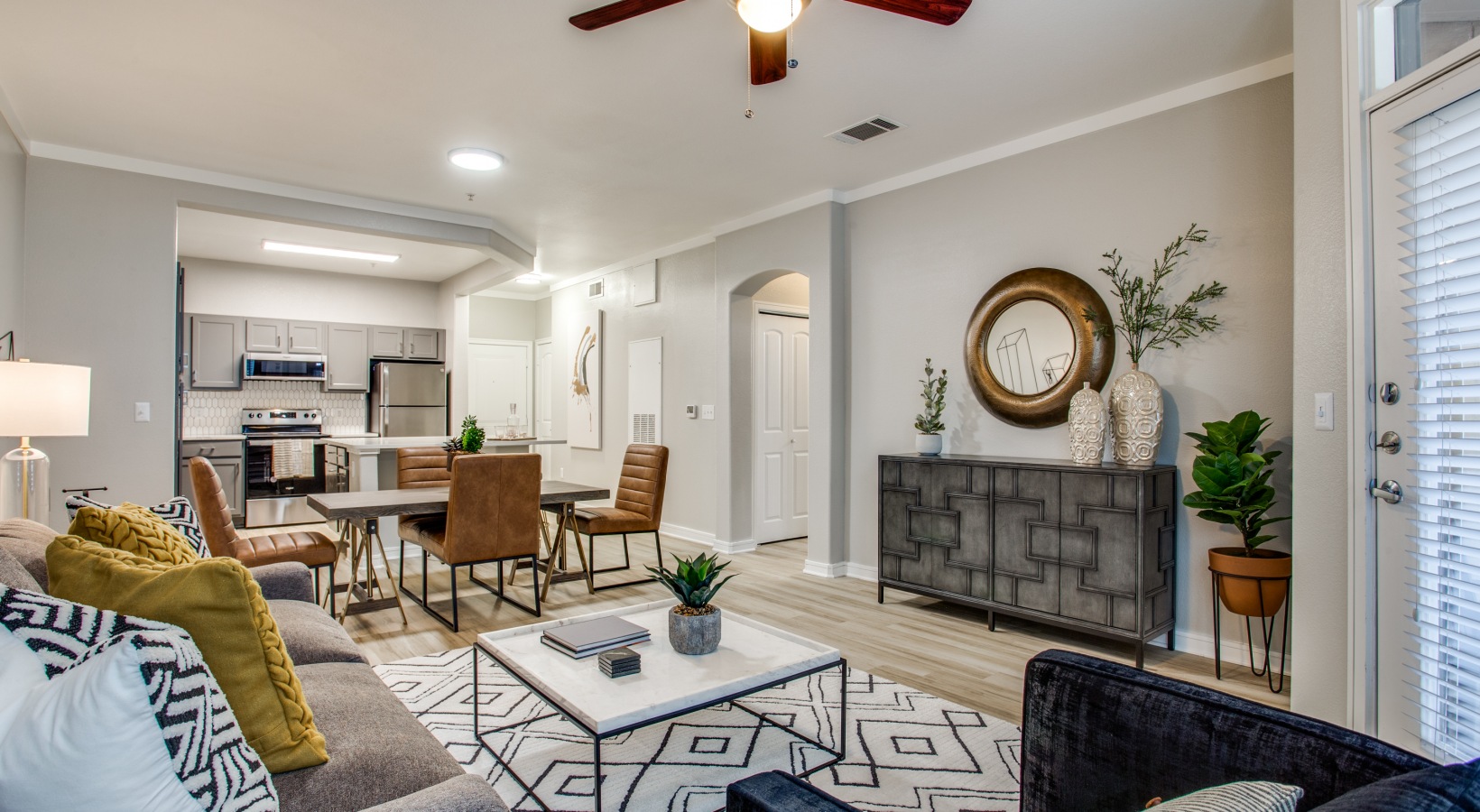 the living room and dining room are clean and well decorated at The  Franklin at Samuels Ave